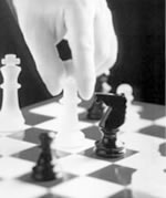 Black & White Chess Pieces on a chess board